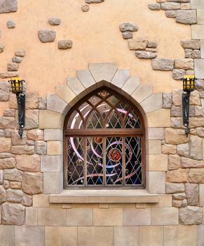 Arched window in a stone wall