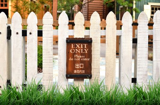 white picket fence and home