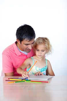 Young family writing on copyspace sitting at a table