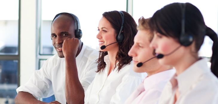 Portrait of a professional multi-ethnic sale representative team at work in a office