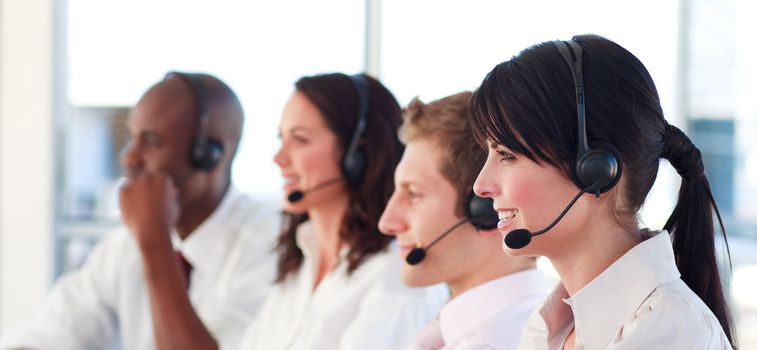 Portrait of a joyful multi-ethnic sale representative team at work in a office