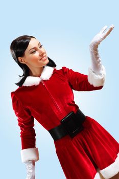 Santa Girl presenting your product, in costume and white gloves