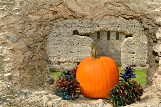 Tabby ruins decorated for autumn with pumpkin and pine cones