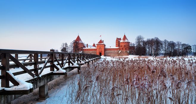 Trakai. Trakai is a historic city and lake resort in Lithuania. It lies 28 km west of Vilnius, the capital of Lithuania.