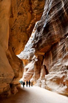 The Siq, the narrow slot-canyon, the entrance passage to the hidden city of Petra, Jordan