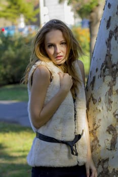 Young, beautiful woman in the city park