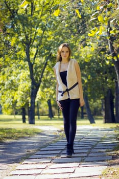 Young, beautiful woman in the city park