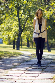 Young, beautiful woman in the city park