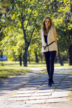 Young, beautiful woman in the city park