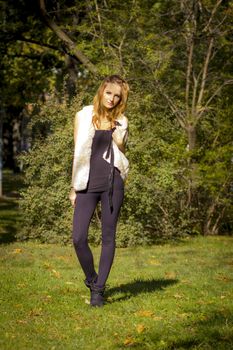 Young, beautiful woman in the city park