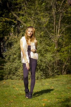 Young, beautiful woman in the city park