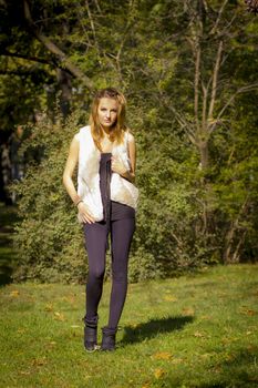 Young, beautiful woman in the city park