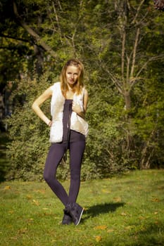 Young, beautiful woman in the city park