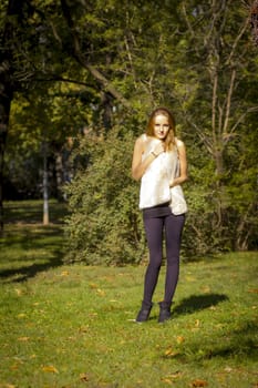 Young, beautiful woman in the city park