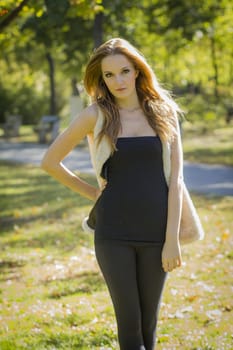 Young, beautiful woman in the city park