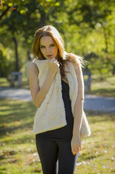 Young, beautiful woman in the city park