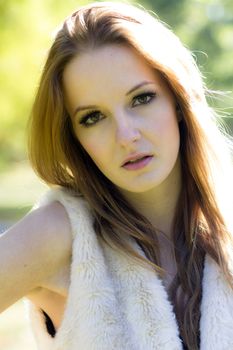 Young, beautiful woman in the city park