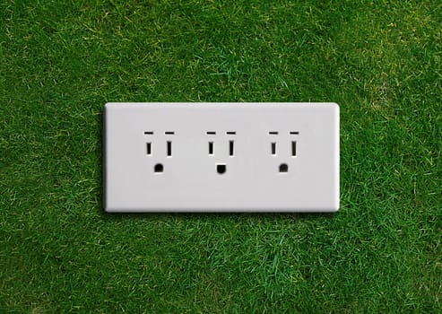 electricity adapter on a green grassland, Green energy concept, Green power.