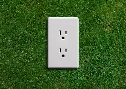 electricity adapter on a green grassland, Green energy concept, Green power.