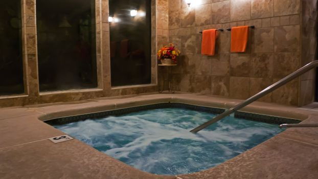 spa with warm marble tiles and towels