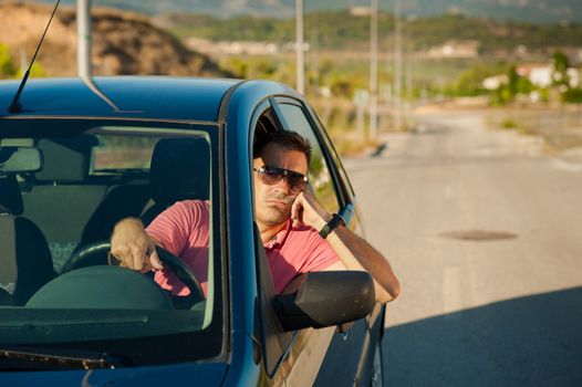 Guy pretty bored while waiting for an open road