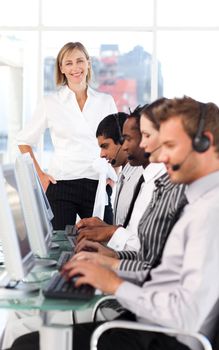 Cheerful female manager leading her representative team in a office