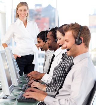 Bright manager leading her representative team in a office