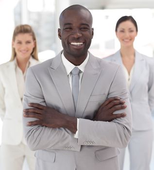 Positive afro-american manager with his team in a office