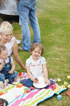 Caucasian family having a picnic together in a park 