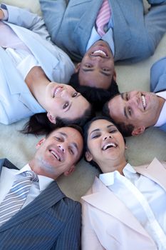 Multi-ethnic business team on floor in a circle