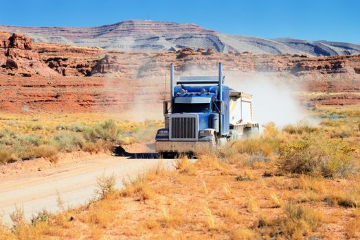 Semi-truck driving across the desert, USA