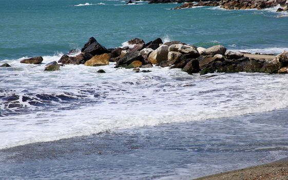 View of the coast, sea waves in a stormy day