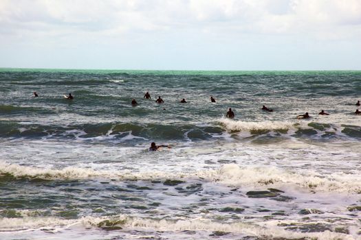 Surfers opening the season in Levanto, Italy.