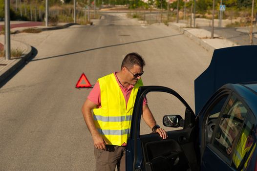 Frustration after a breakdown, guy not very pleased with his car