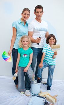 Happy family decorating their new house after move in