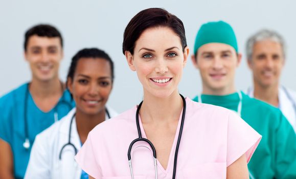 Female Doctor standing in Front of her team in the hospital