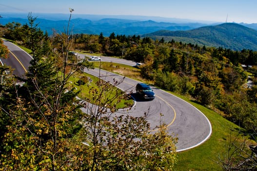 Road curves pass through the mountain and forest