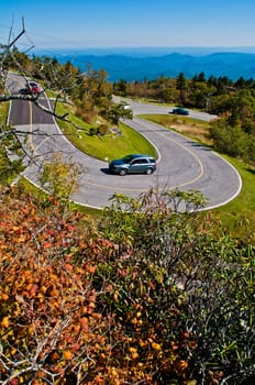 Road curves pass through the mountain and forest