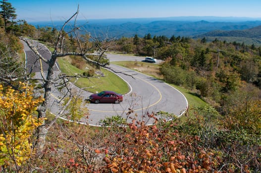 Road curves pass through the mountain and forest