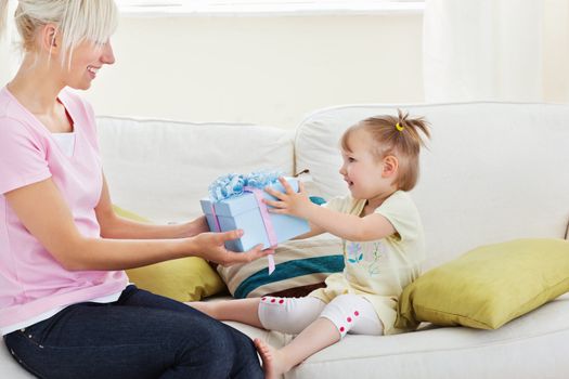 Beauty woman get surprise by her daughter in living room