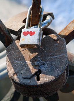 Love padlocks - symbol of eternal happiness.  Love padlocks hanging on the railing of the bridge