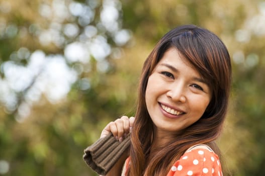 Portrait Of Asian Young Woman In garden in winter season