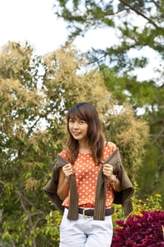 Portrait Of Asian Young Woman In garden in winter season