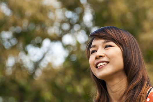 Portrait Of Asian Young Woman In garden in winter season