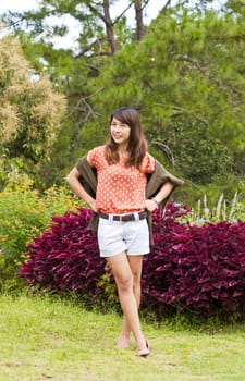 Portrait Of Asian Young Woman In garden in winter season