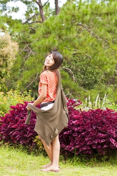 Portrait Of Asian Young Woman In garden in winter season