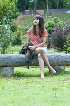 Portrait Of Asian Young Woman In garden in winter season