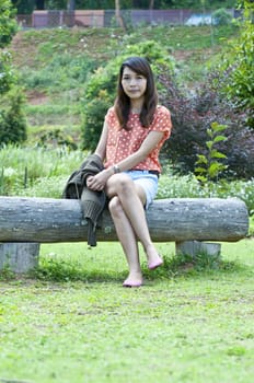 Portrait Of Asian Young Woman In garden in winter season