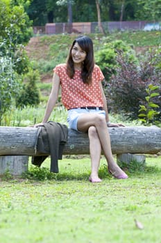 Portrait Of Asian Young Woman In garden in winter season