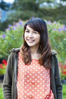 Portrait Of Asian Young Woman In garden in winter season